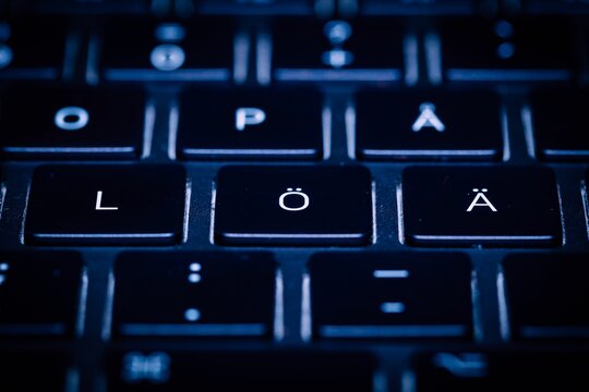 Language keyboard with white lettering, keys and their corresponding characters