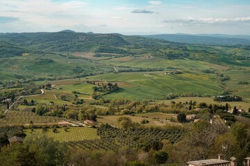 Fototapeta na wymiar Aerial view of lush rolling hills and valleys in Montepulciano, Tuscany