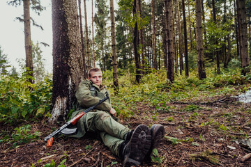 A terrorist on a break from warfare, resting during heavy war fare and attack