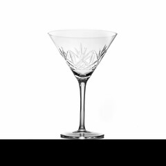 Crystal-clear cocktail glass sits atop a rustic wooden plinth, ready to be enjoyed