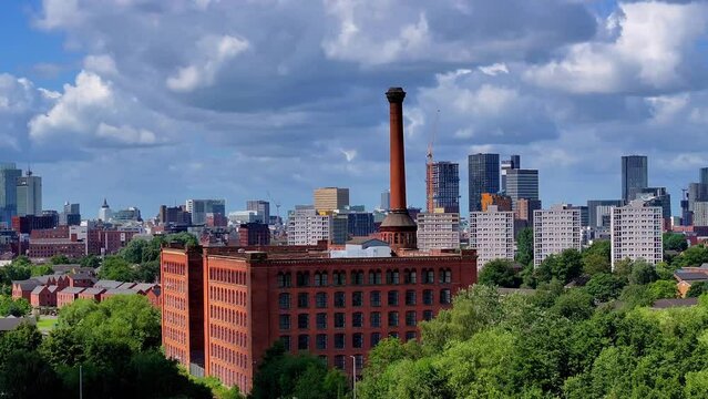 Manchester Skyline panoramic view showing red brick old warehouse and chimney. 