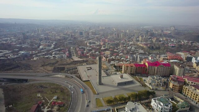 Drone view over 50th Anniversary of October Revolution memorial and the cityscape of Yerevan