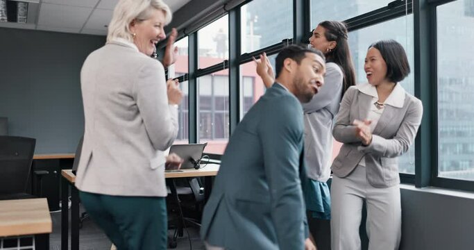 Business people, diversity and dance in office for celebration, success and motivation of bonus. Corporate team building, happy asian man and dancing with friends for winning, funny group and freedom