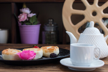 curd cheesecakes on a black plate. Grocery still life, cooking recipe
