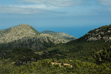 Obraz premium Hiking holidays Mallorca, Spain. Beautiful picture with landscape of Serra de Tramuntana mountains in the island of Majorca in Mediterranean sea. Paradise for bikers. Adventure travel.