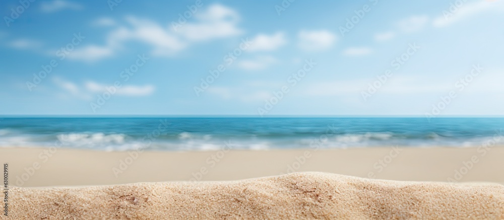 Poster close-up shot of sand with a blurred background of the sea and sky on a summer day. suitable for pro