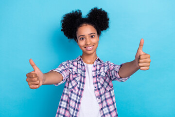 Photo of confident pretty lady wear checkered shirt showing you two thumbs up isolated blue color...