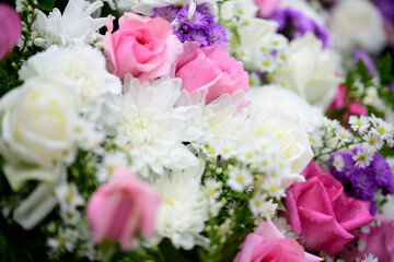 Creative layout made of colorful flowers and leaves for decoration at wedding.Roses in a mixed flower bouquet on vintage style.Floral background.