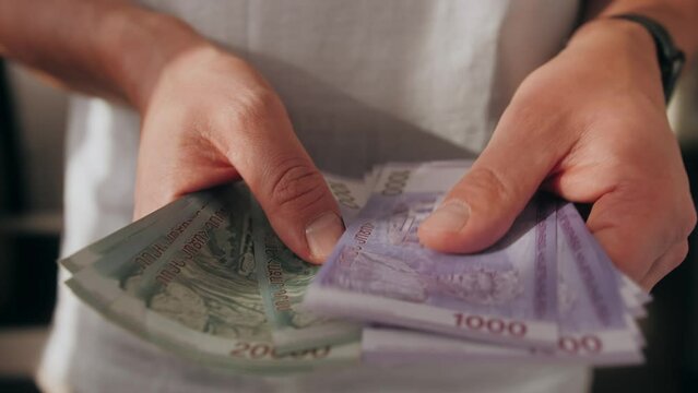 Man Counting Armenian Money Close up, Armenia dram amd banknotes, Tourist Exchgange Money in Bank of the Republic in Yerevan.