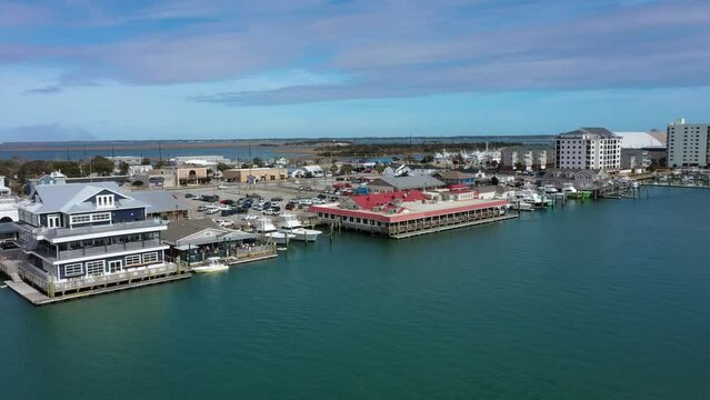 Aerial View of the Morehead City waterfront looking towards restaurants condos and a marina
