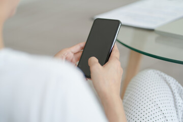 Happy beautiful Asian Woman wearing headphones using laptop at work or enjoying music