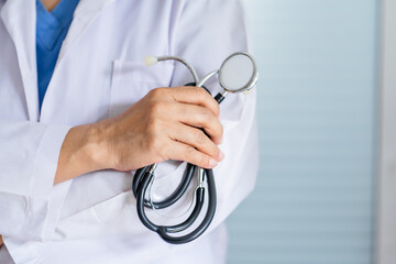 senior asian woman doctor wearing glasses and uniform with stethoscope in hand&nbsp;Healthcare and medical concept