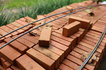 Pallet a red brick building material stack of new red bricks for construction.