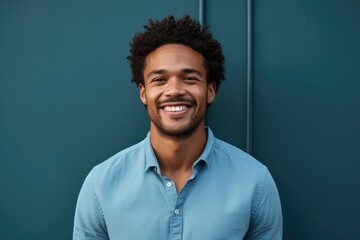 Fototapeta premium Smiling young man stands against the solid color background background - AI Generated
