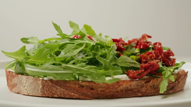American pastrami sandwich in New York ham meet cuts. chef cooking Famous thick cut sous vide beef sandwich on restaurant cafe kitchen. Bread with curd cheese. Studio shot close up.