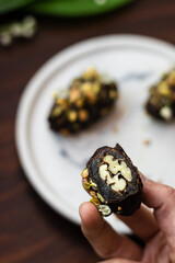 Chocolate dates with pistachio nuts 