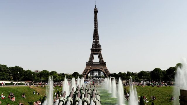 Eiffel Tower with artesian well, water gush in summer holiday