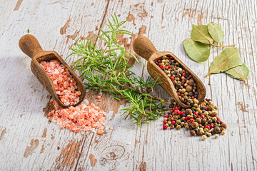 Wooden ladles with coarse salt and peppercorns - Powered by Adobe