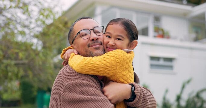 Father, child and family hug outdoor in a backyard with a smile, happiness and love. Portrait of happy man and girl kid or daughter together for support, quality time and bonding with care at a house
