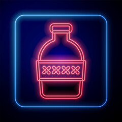 Glowing neon Bottle of water icon isolated on black background. Soda aqua drink sign. Vector