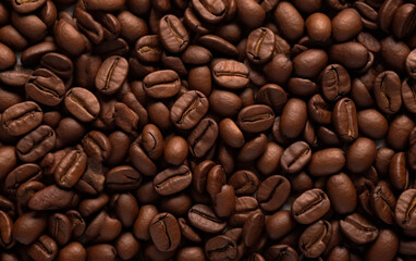Naklejka premium Overhead view of backdrop representing halves of dark brown coffee beans with pleasant scent