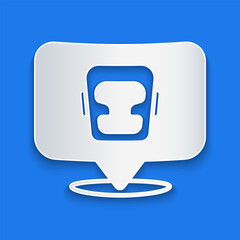 Paper cut Boxing helmet icon isolated on blue background. Paper art style. Vector