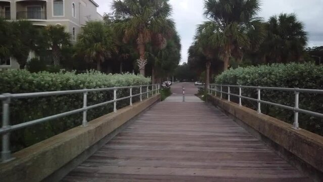 walking  back on the fishing pier at Jungle Low Tide at Prada de Narvaez Park in St. Petersburg, FL. POV