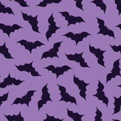 Seamless vector pattern dark purple spooky bats silhouettes on purple, halloween. Textile, scrapbook