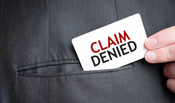Card with CLAIM DENIED text in pocket of businessman suit. Investment and decisions business concept.