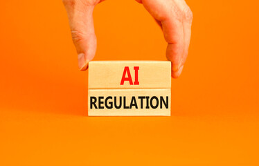 AI regulation symbol. Concept words AI artificial intelligence regulation on beautiful wooden block. Beautiful orange background. Business AI artificial intelligence regulation concept. Copy space