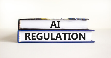 AI regulation symbol. Concept words AI artificial intelligence regulation on beautiful books. Beautiful white background. Business AI artificial intelligence regulation concept. Copy space