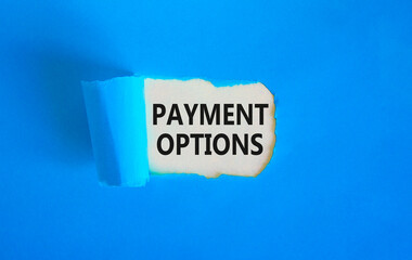 Payment options symbol. Concept words Payment options on beautiful white paper. Beautiful blue background. Business payment options concept. Copy space.