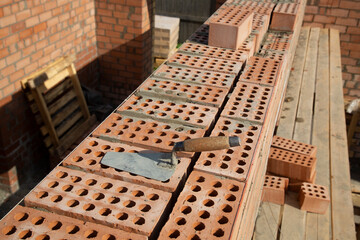 Laying bricks. Construction of a new house.Construction of a brick house.