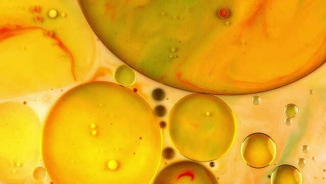 Fantastic Abstract Orange And Yellow Liquid With Beautiful Bubbles And Oil Drops Floating On The Surface 