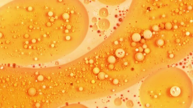 Fantastic Abstract Orange Liquid With Small Beautiful Acrylic Bubbles And Oil Drops Floating On The Surface 