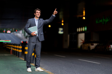 Millennial businessman catching car taxi on the street © Prostock-studio