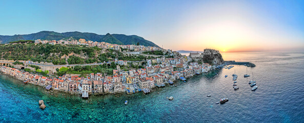 Panoramic view of Scilla with blue sea and castle Ruffo on the rocks, Calabria, Italy