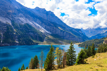 View of Oeschinen lake (Oeschinensee) and Swiss Alps near Kandersteg in Bernese Oberland, Switzerland
