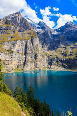 View of Oeschinen lake (Oeschinensee) and Swiss Alps near Kandersteg in Bernese Oberland, Switzerland