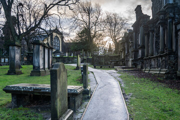 Scenic Greyfriars Kirkyard surrounding Greyfriars Kirk, one of the most visited tourist attractions of Edinburgh
