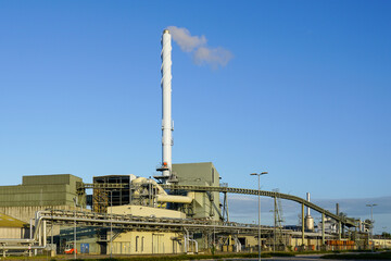 External view of equipment of large modern biomass co-generation wood chip power plant - obrazy, fototapety, plakaty