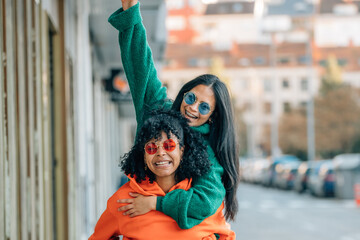 multiethnic girls having fun out loud on the street