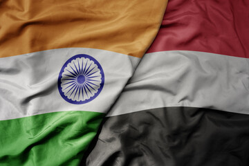 big waving realistic national colorful flag of india and national flag of yemen .