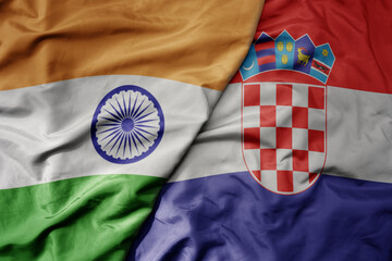 big waving realistic national colorful flag of india and national flag of croatia .