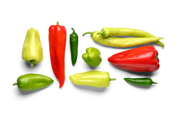 Different fresh peppers on white background