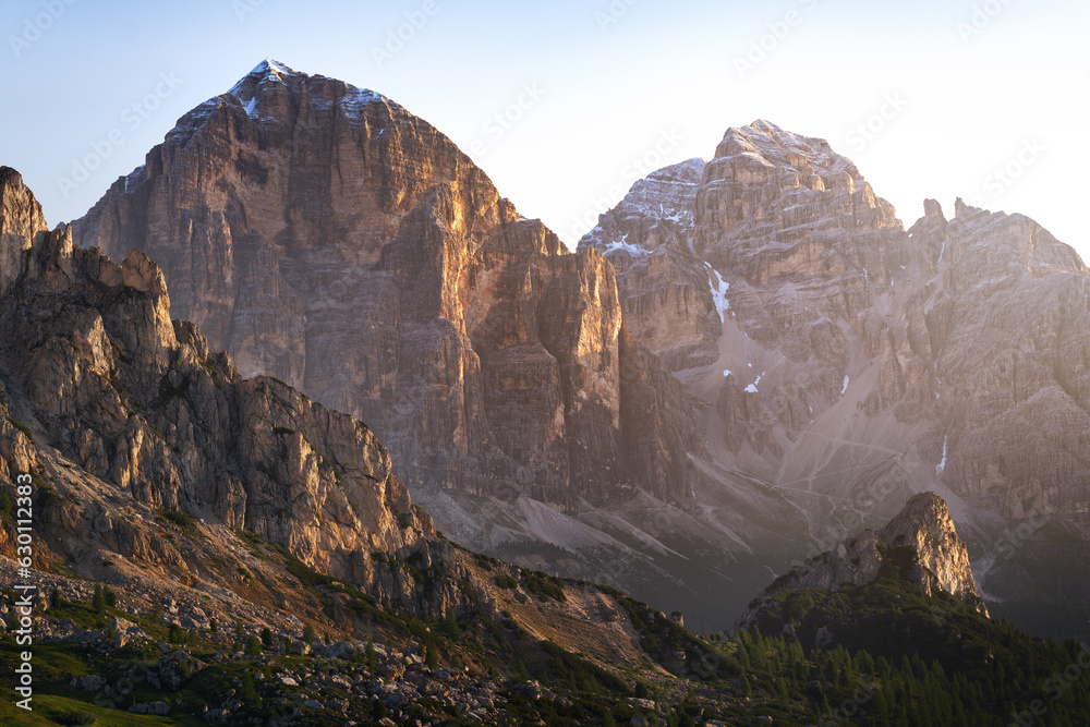 Wall mural beautiful rocky mountains or rocks illuminated by the beautiful morning sun. mountain peaks in the d