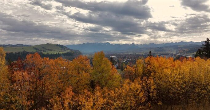 Autumn landscape in the mountains -reveal shot of Bialka Tatrzanska, Podhale, Poland in autumn.