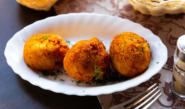 Traditional Belarusian pyzy filled with mushrooms served with chopped fresh dill