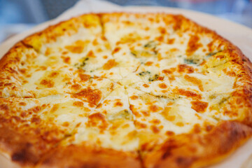 Appetizing cheese pizza. A dish of Italian cuisine.