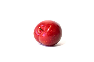 Ripe plum isolated on white background.